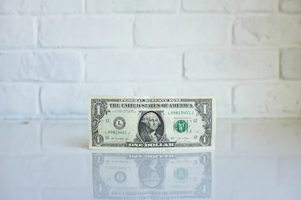 Dollar bill representing Prius hybrid battery replacement costs
