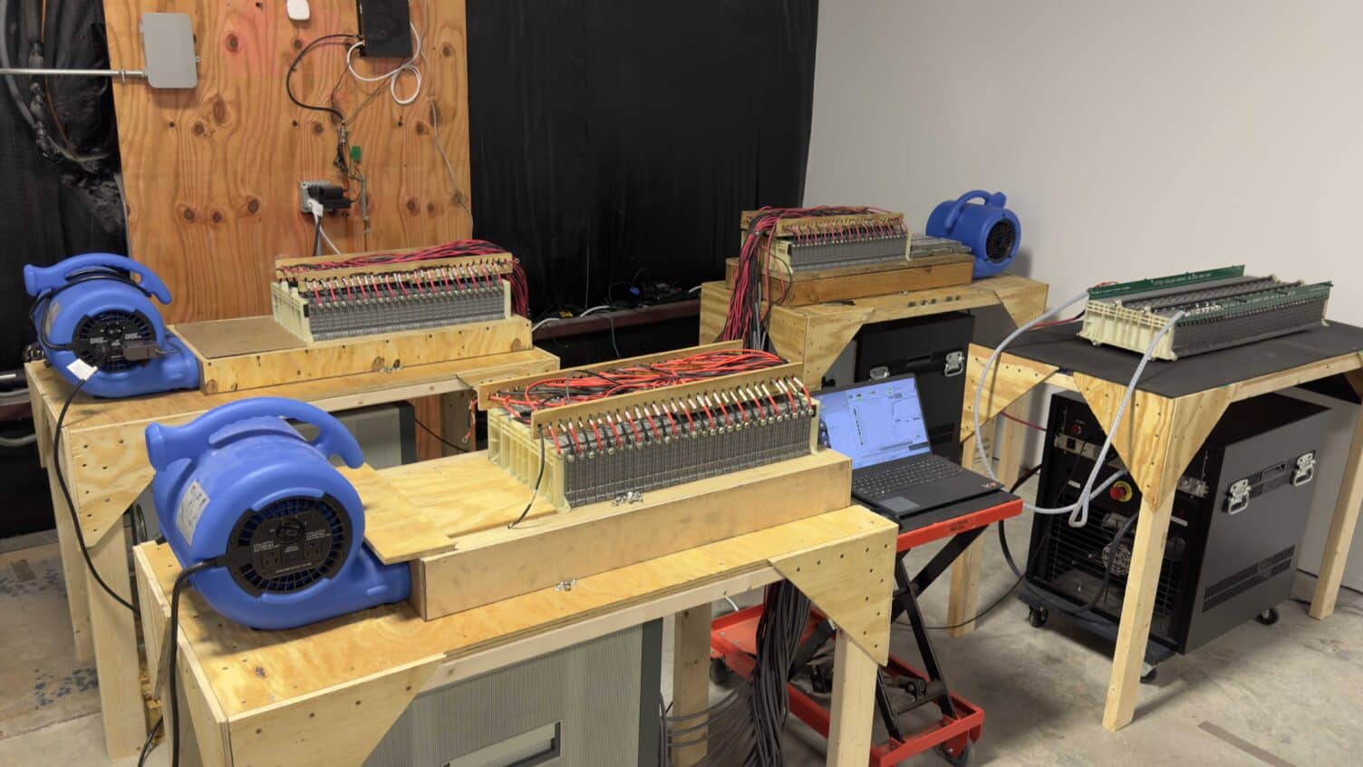 Interior of Hybrid Battery Service autoshop showing professional equipment for diagnostics and repair
